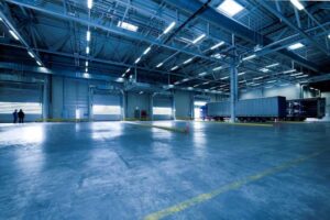 a large warehouse with a lot of trucks