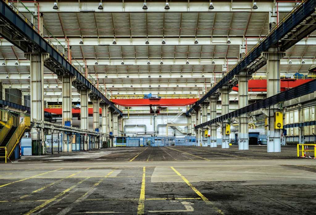 an empty warehouse with a lot of machinery